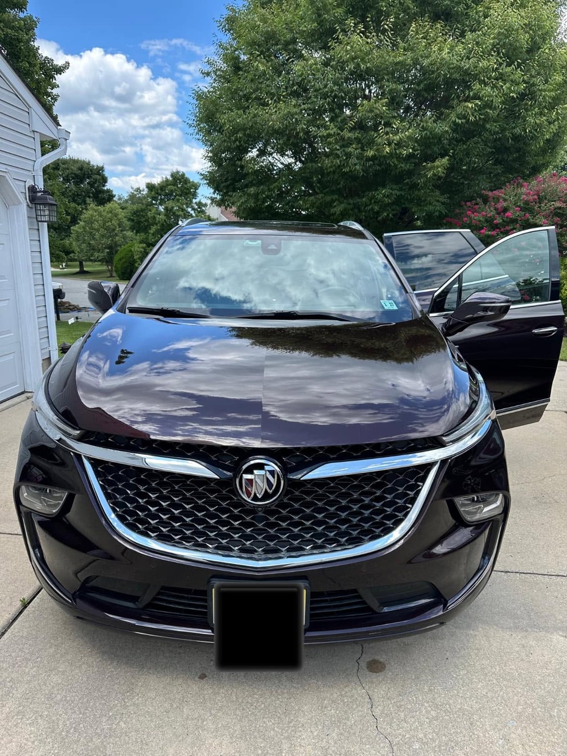 Glossy black Buick Enclave detailed inside and out