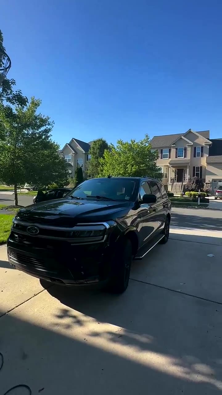 Black Ford Expedition gleaming after a full detail